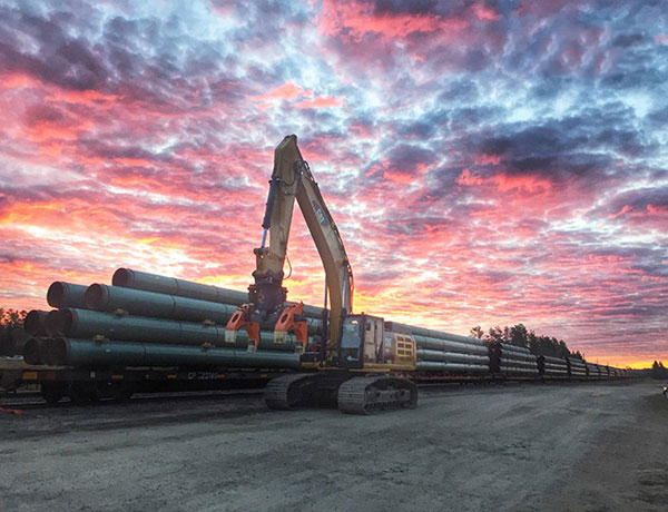 Case study of DECKHAND® pipe handler equipment sales and rentals set against a sunset