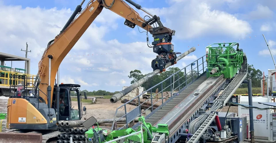 HDD Drill Rod Handling with a DECKHAND® on a job site in New Zealand with UEA. This DECKHAND® is decked out for civil construction and HDD use with its Directional Drilling Arms.