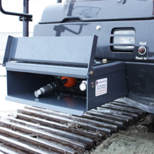 Auxiliary Hydraulic Hose Reel is seen hidden away in a custom-designed step installed on an excavator in a Utility set-up.